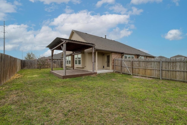 back of house featuring a patio, brick siding, and a shingled roof