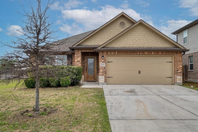 view of front of home with concrete driveway, a garage, brick siding, and a front lawn