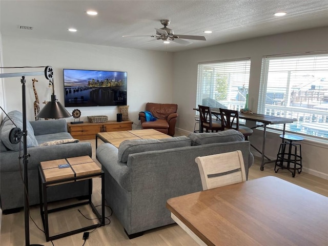 197 Port Saint Claire, Aransas Pass, TX 78336 - living room featuring plenty of natural light, ceiling fan, light wood-style floors, baseboards, and recessed lighting
