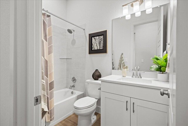 506 Diamondleaf Dr, Buda, TX 78610 - full bath with toilet, vanity, shower / bath combo with shower curtain, and wood finished floors