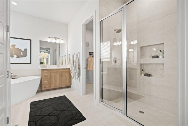 506 Diamondleaf Dr, Buda, TX 78610 - full bathroom with a shower stall, vanity, and a soaking tub