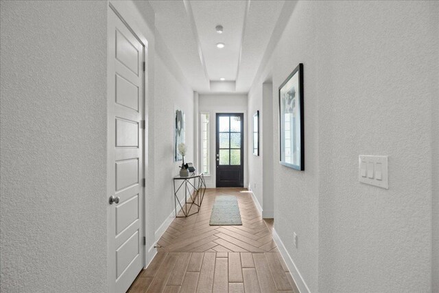 506 Diamondleaf Dr, Buda, TX 78610 - hall with a textured wall, baseboards, wood finished floors, and recessed lighting