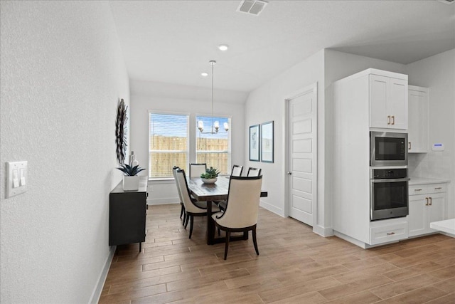 506 Diamondleaf Dr, Buda, TX 78610 - dining room with light wood-style floors, baseboards, a chandelier, and recessed lighting