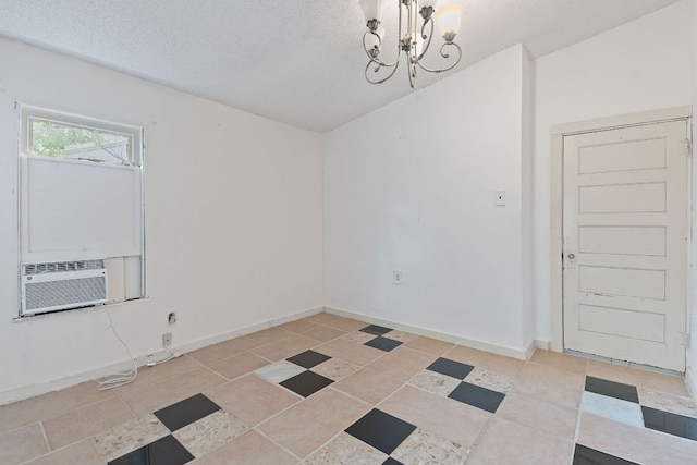 18309 Lake Oaks Dr, Jonestown, TX 78645 - unfurnished room with a chandelier, baseboards, a textured ceiling, light tile patterned floors, and cooling unit