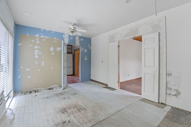 18309 Lake Oaks Dr, Jonestown, TX 78645 - spare room featuring a ceiling fan, healthy amount of natural light, and wood finished floors