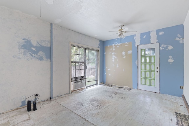 18309 Lake Oaks Dr, Jonestown, TX 78645 - unfurnished room featuring a ceiling fan, wood finished floors, and cooling unit
