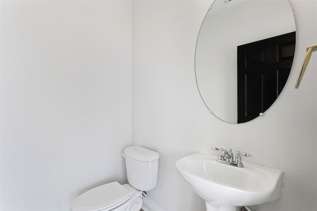 5408 Downs Dr Unit 1, Austin, TX 78721 - half bath featuring a sink and toilet
