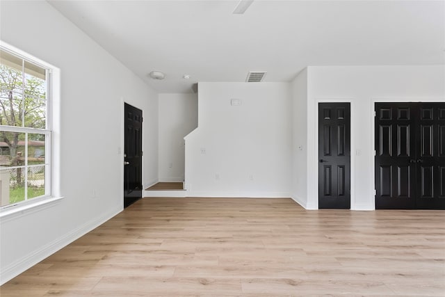 5408 Downs Dr Unit 1, Austin, TX 78721 - spare room featuring light wood-style floors and baseboards