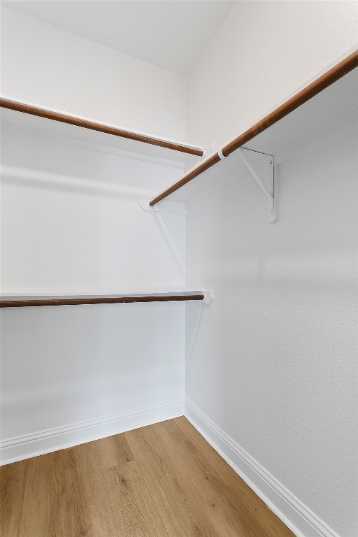 5408 Downs Dr Unit 1, Austin, TX 78721 - walk in closet with light wood-style flooring