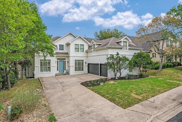 9204 Eddy Cv, Austin, TX 78735 - traditional-style home with a garage, stucco siding, driveway, and a front yard