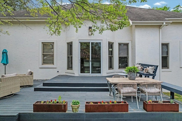 9204 Eddy Cv, Austin, TX 78735 - back of property featuring a wooden deck, stucco siding, and outdoor lounge area
