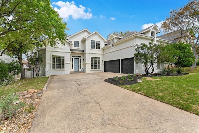 9204 Eddy Cv, Austin, TX 78735 - view of front of house featuring fence, a garage, stucco siding, a front yard, and driveway