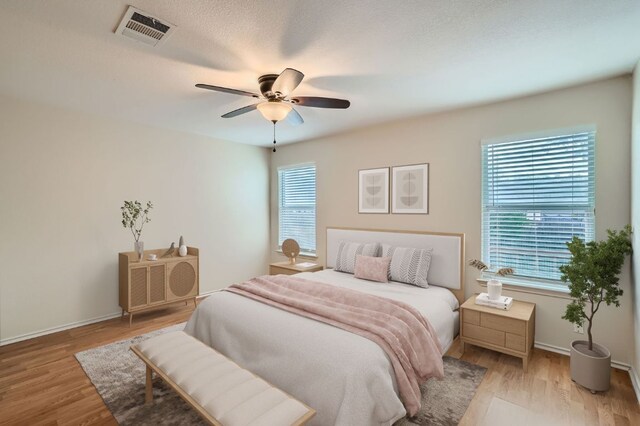 1142 Sundrop Pl, Round Rock, TX 78665 - bedroom featuring light wood-type flooring and a ceiling fan