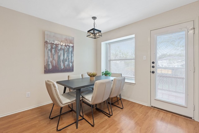 1142 Sundrop Pl, Round Rock, TX 78665 - dining room with light wood-style floors and a chandelier