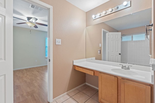 1142 Sundrop Pl, Round Rock, TX 78665 - bathroom with a ceiling fan, vanity, and wood finished floors