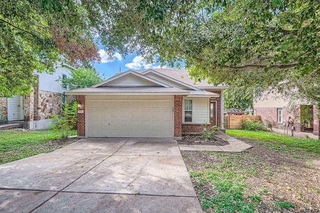 1142 Sundrop Pl, Round Rock, TX 78665 - single story home with brick siding, driveway, and an attached garage