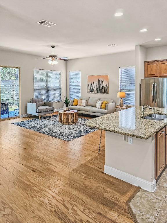 10601 Twisted Elm Dr, Austin, TX 78726 - living area with light wood-style flooring, ceiling fan, and recessed lighting