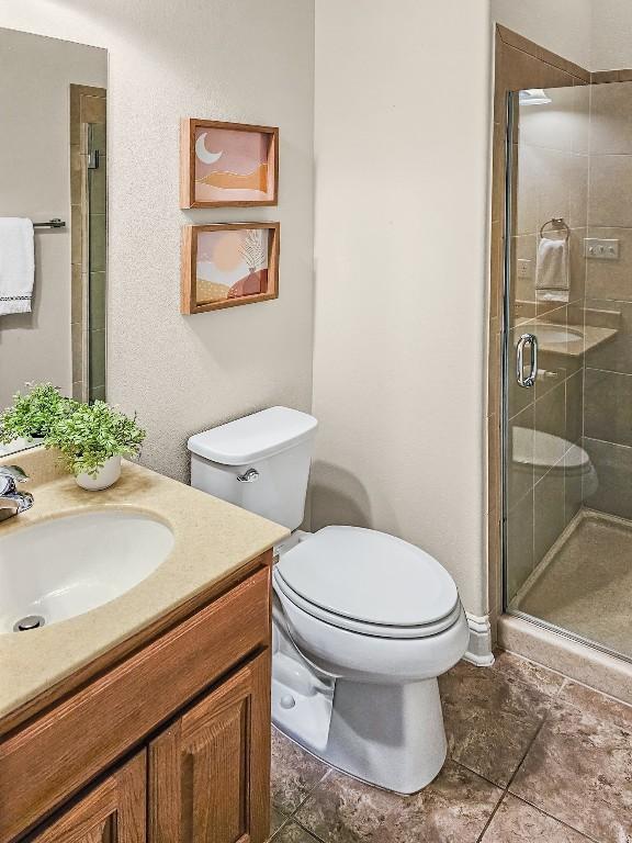 10601 Twisted Elm Dr, Austin, TX 78726 - full bath with vanity, a stall shower, and tile patterned flooring