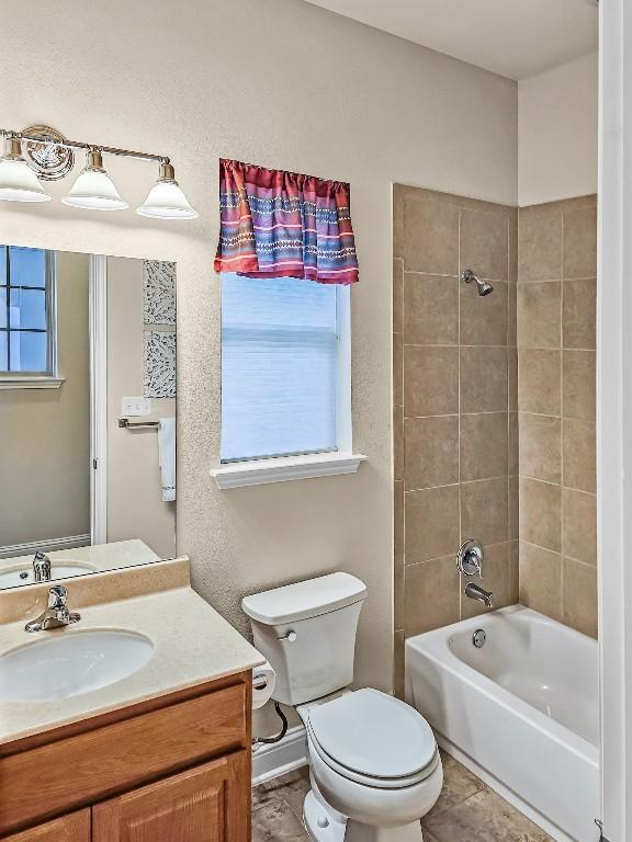 10601 Twisted Elm Dr, Austin, TX 78726 - bathroom with vanity and shower / tub combination