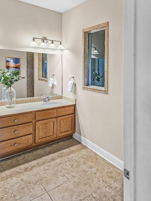 10601 Twisted Elm Dr, Austin, TX 78726 - bathroom featuring vanity and baseboards