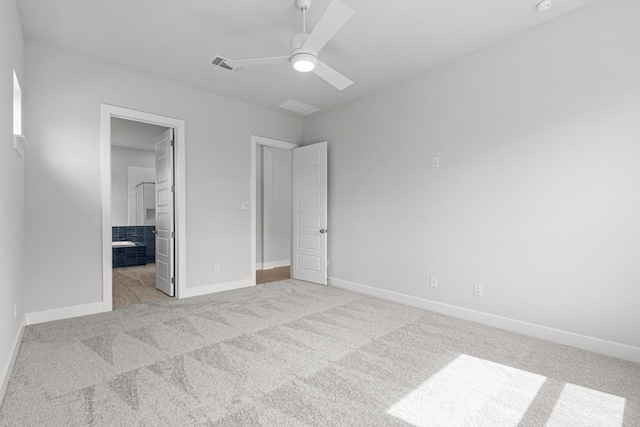 8212 Bouvreuil Dr, Austin, TX 78738 - unfurnished bedroom with light colored carpet, baseboards, a ceiling fan, and connected bathroom
