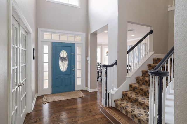 10204 Treasure Island Dr, Austin, TX 78730 - foyer with a high ceiling, dark wood-style floors, and stairs