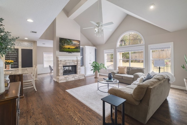 10204 Treasure Island Dr, Austin, TX 78730 - living area with a ceiling fan, high vaulted ceiling, dark wood finished floors, a stone fireplace, and recessed lighting