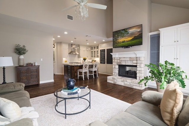 10204 Treasure Island Dr, Austin, TX 78730 - living area with high vaulted ceiling, a ceiling fan, dark wood finished floors, a fireplace, and recessed lighting