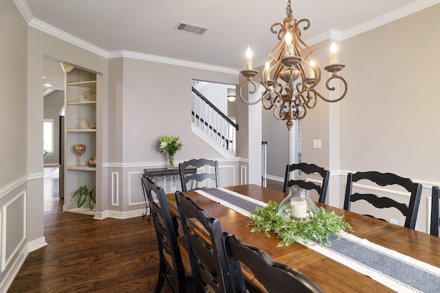 10204 Treasure Island Dr, Austin, TX 78730 - dining space featuring a chandelier, built in features, wood finished floors, crown molding, and stairs