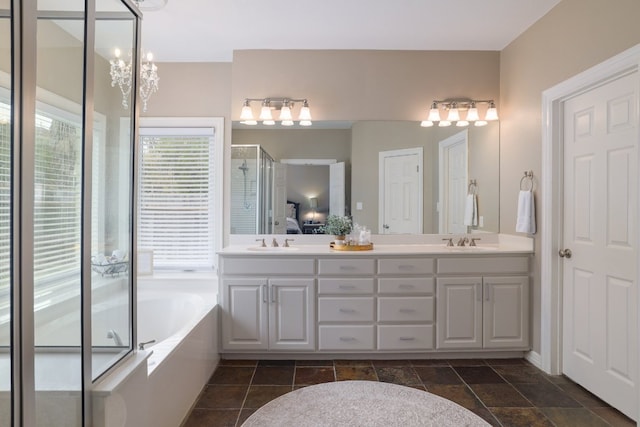 10204 Treasure Island Dr, Austin, TX 78730 - full bathroom with a bath, double vanity, and a stall shower