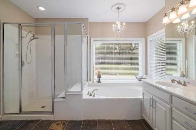 10204 Treasure Island Dr, Austin, TX 78730 - bathroom with a chandelier, vanity, a shower stall, and a bath