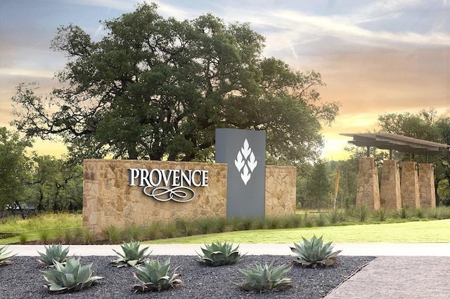 8408 Bouvreuil Dr, Austin, TX 78738 - community sign with a lawn