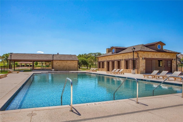 8408 Bouvreuil Dr, Austin, TX 78738 - community pool featuring a patio area