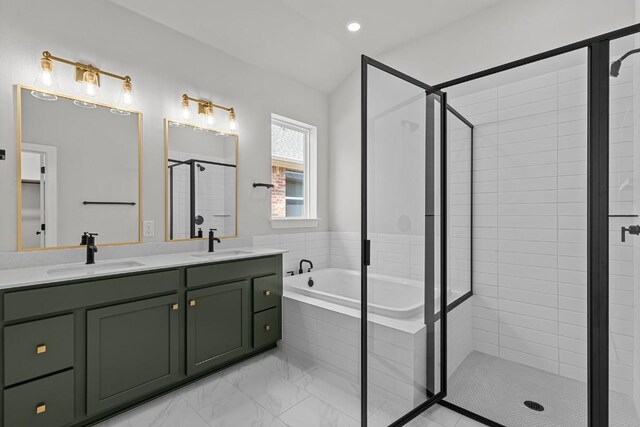 8408 Bouvreuil Dr, Austin, TX 78738 - bathroom with a stall shower, a garden tub, double vanity, and marble look tile flooring