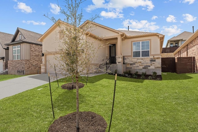 8408 Bouvreuil Dr, Austin, TX 78738 - view of front of house with concrete driveway, stucco siding, stone siding, and a garage