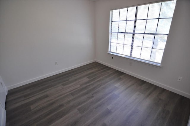 12223 Antoinette Pl, Austin, TX 78727 - spare room featuring dark wood-style floors and baseboards