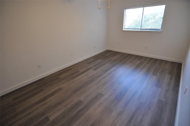 12223 Antoinette Pl, Austin, TX 78727 - spare room featuring dark wood-type flooring and baseboards