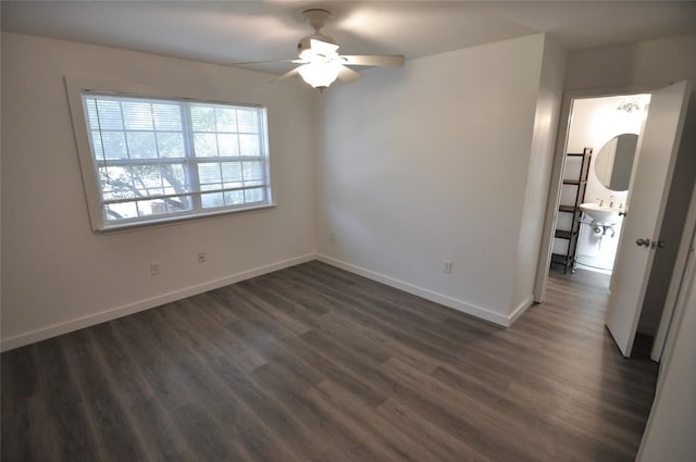 12223 Antoinette Pl, Austin, TX 78727 - unfurnished room with dark wood-style flooring, baseboards, and ceiling fan