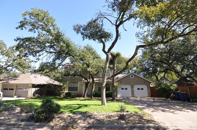 12223 Antoinette Pl, Austin, TX 78727 - ranch-style house with a garage, concrete driveway, fence, and a front yard