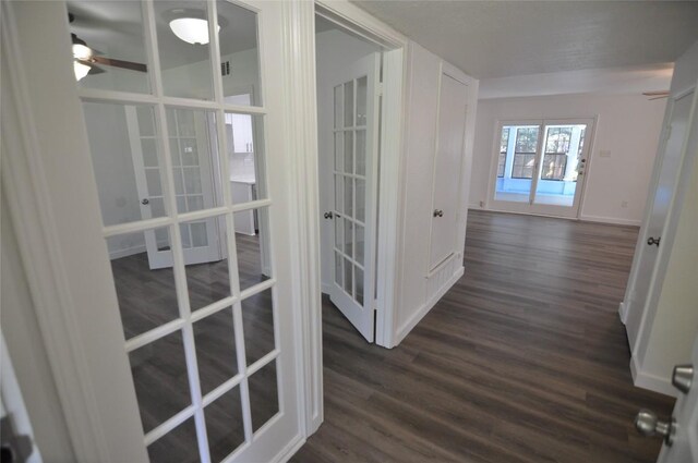 12223 Antoinette Pl, Austin, TX 78727 - hallway with french doors, dark wood-style floors, and baseboards