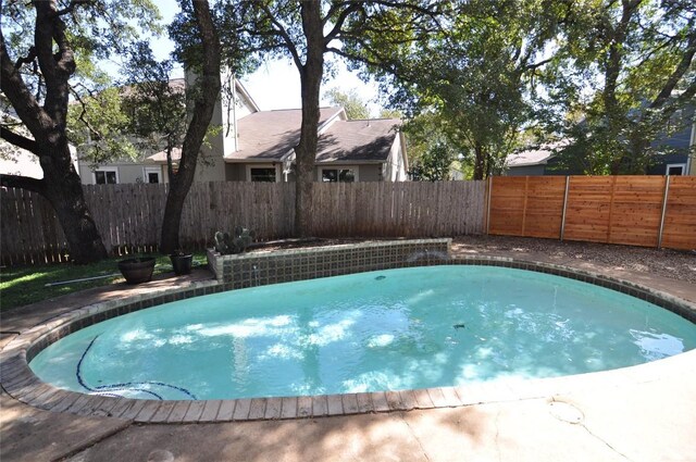 12223 Antoinette Pl, Austin, TX 78727 - view of swimming pool with a fenced in pool and a fenced backyard