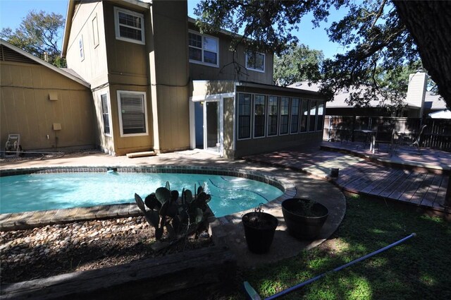 12223 Antoinette Pl, Austin, TX 78727 - view of swimming pool featuring a patio area, a sunroom, a deck, and a fenced in pool