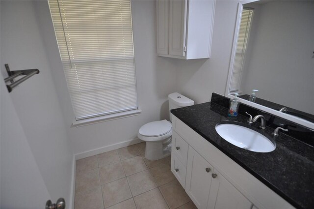 12223 Antoinette Pl, Austin, TX 78727 - bathroom featuring toilet, vanity, tile patterned floors, and baseboards