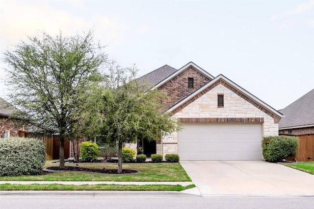 view of front of home with stone siding, fence, an attached garage, concrete driveway, and a shingled roof