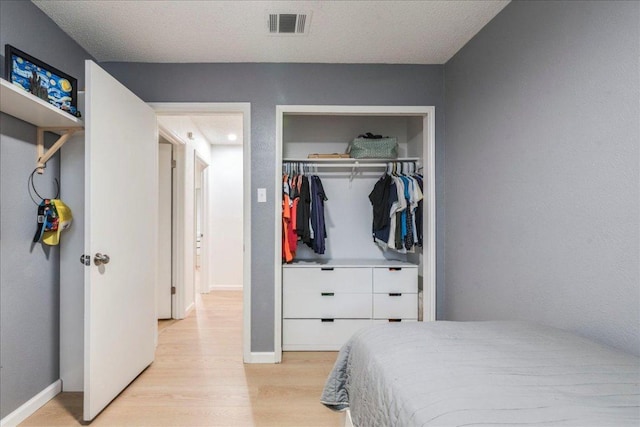 8614 Croydon Loop, Austin, TX 78748 - bedroom featuring light wood-type flooring and a closet