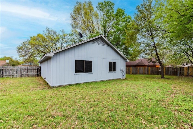 8614 Croydon Loop, Austin, TX 78748 - rear view of property featuring board and batten siding and a fenced backyard