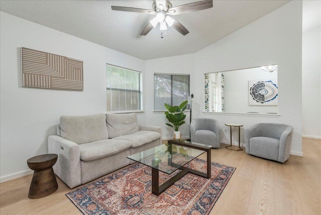 8614 Croydon Loop, Austin, TX 78748 - living area with wood finished floors, a ceiling fan, and vaulted ceiling
