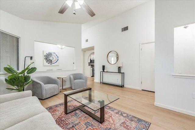 8614 Croydon Loop, Austin, TX 78748 - living area featuring a ceiling fan, light wood-style flooring, and high vaulted ceiling