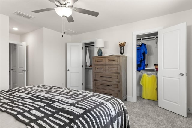 bedroom featuring light carpet, attic access, baseboards, a closet, and a ceiling fan