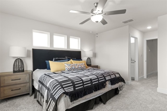 bedroom with light colored carpet, baseboards, and a ceiling fan